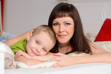 mom with her son on the bed