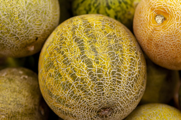 Fresh juicy melon on the counter of the store. View from above.