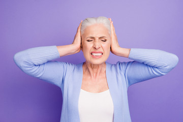 Portrait of grey haired old nice beautiful annoyed woman with pa