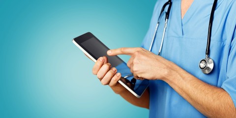 Close-up Doctor at hospital working with tablet