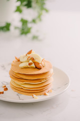 banana cashew pancakes with bananas and salted caramel sauce. the toning. selective focus