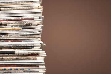 Pile of newspapers on background