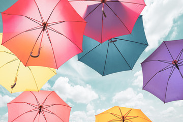 Colorful umbrellas background. Colorful umbrellas in the sky. Street decoration. © sutthinon602
