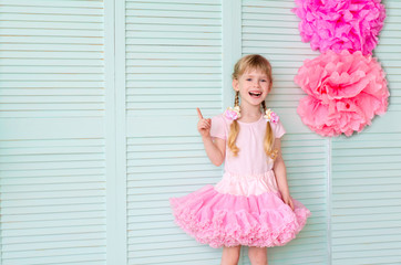 girl with pigtails, wearing a skirt tutu