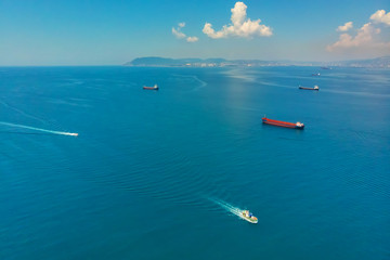 Ships at anchorage. Boat in the sea on the water top view