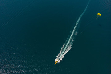 Aerial view of the boat and parachute in the sea