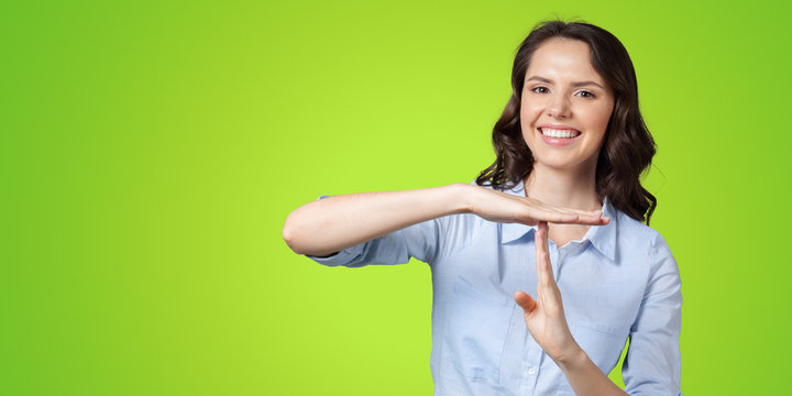 Girl making time out gesture
