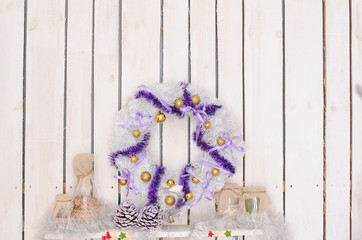 Christmas wreath on  white wooden wall