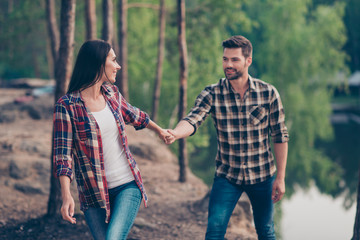 Fototapeta premium Nice lovely couple, spouses wearing casual checkered shirts and 