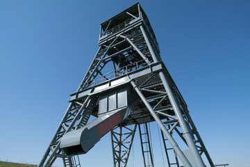 Oil drilling rig on blue sky