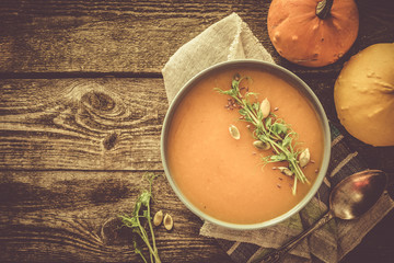 Pumpkin soup with pea micro green and seeds