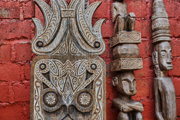 Different wooden Balinese souvenirs displayed in art and craft tourist market. Indonesian handicrafts. Souvenir from Bali. Traditional product of handicraft. Typical souvenirs at the famous market..