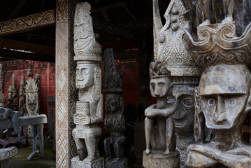 Different wooden Balinese souvenirs displayed in art and craft tourist market. Indonesian handicrafts. Souvenir from Bali. Traditional product of handicraft. Typical souvenirs at the famous market..