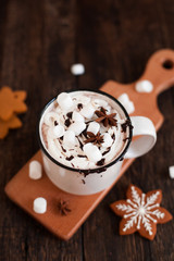 Mug of hot chocolate or cocoa with Christmas cookies and marsmallow