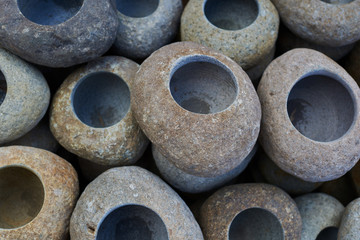 Handicrafts sinks, made of natural stone stacked in a warehouse. Stack of stone handmade bowls. Expensive quality materials, luxury. Minimalist sink for design loft Interior. Stylish, modern concept.