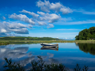 The Blue Boat and Reflections - Laugharne Estuary.