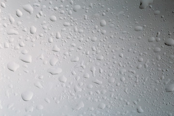 Water drops background texture, raindrops of water on glass surface