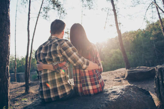 Rear back view of two people, happy romantic couple in love, wea