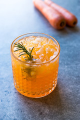 Carrot Cocktail with Crushed Ice and Rosemary.