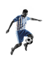 Fototapeta na wymiar Professional football soccer player with ball isolated on white studio background