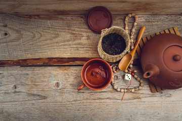 clay teapot on an old board