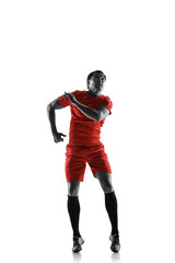 Professional football soccer player in motion isolated on white studio background