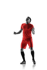 Professional football soccer player in motion isolated on white studio background