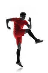 Professional football soccer player in motion isolated on white studio background