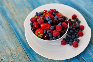 Berries beautifully served on a white cookware