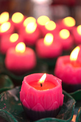 Flower candles burning at night.