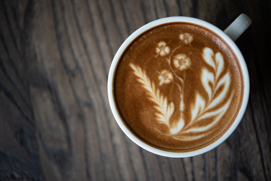 Top view latte art coffee cup.