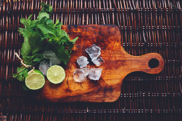 ingredients of summer cocktail mojito on the wooden desk
