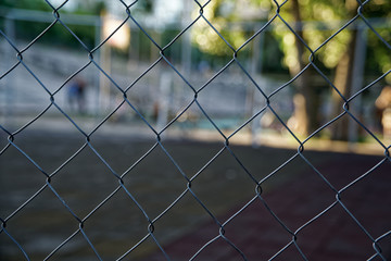 Mesh aluminium wire with defocused background, business concept