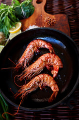 Young married couple has prepared a romantic light dinner of prawn