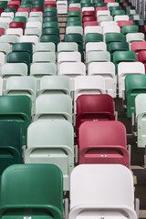 Colored chairs Empty tribuns of a modern stadium without spectators