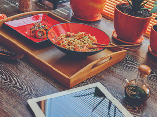 Lunch at the office, Japanese sushi and noodles to order from the fish restaurant, sticks, soy sauce in a set
