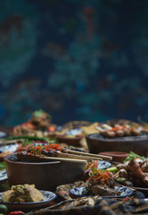 Freshly prepared delicious varieties of dishes on table. Many food dishes on table