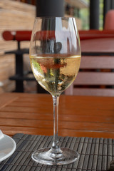 White wine in the glass on the table