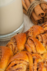 Pie with cinnamon and sugar on a wooden background.