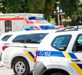 Signal lamps on police cars against a fragment of a city street. (Security, help, law - concept)