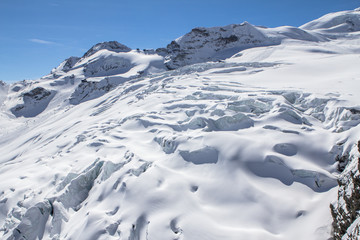 Snow-covered glacier in a Mountains of Saas-Fee in Switzerland