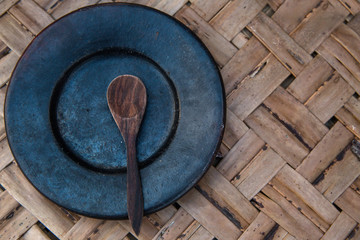 Plates arranging on the wooden table, top view. Tableware in form of plates