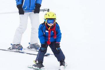Naklejka premium Young child, skiing on snow slope in ski resort in Austria