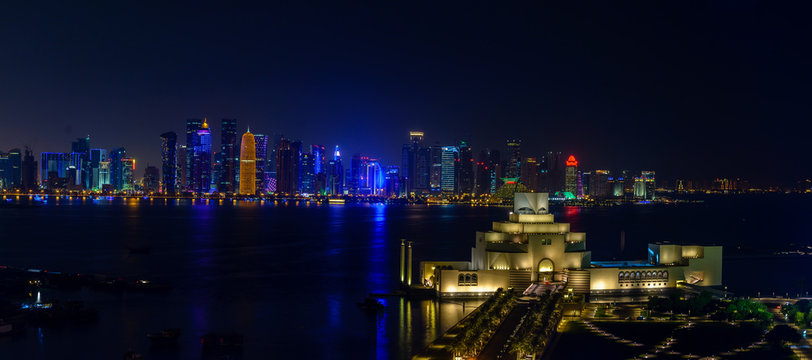 Doha Qatar night skyline panorama with Museum of Islamic Arts
