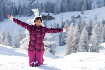 Fototapeta na wymiar People enjoying winter holiday in ski resort