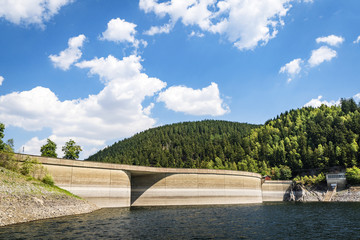 River with a dam surrounded by hills