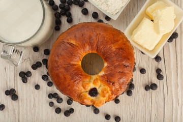 Cake with berries inside on a wooden background.