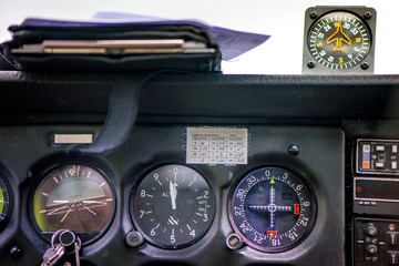 Detail of old airplane cockpit. Aircraft equipment, various indicators, buttons, instruments. The flight desk and control panel during take off and landing. Aircraft dashboard panel in pilot school