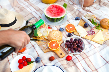 Summer Picnic Basket on the Green Grass. Food and drink concept. Friends Party time
