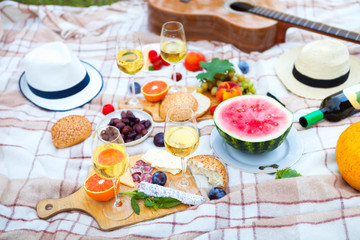 Summer Picnic Basket on the Green Grass. Food and drink concept. Friends Party time